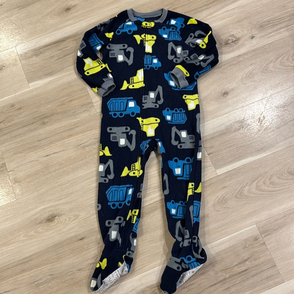 Long sleeved, footed, fleece pyjamas for boy. Construction vehicle print.